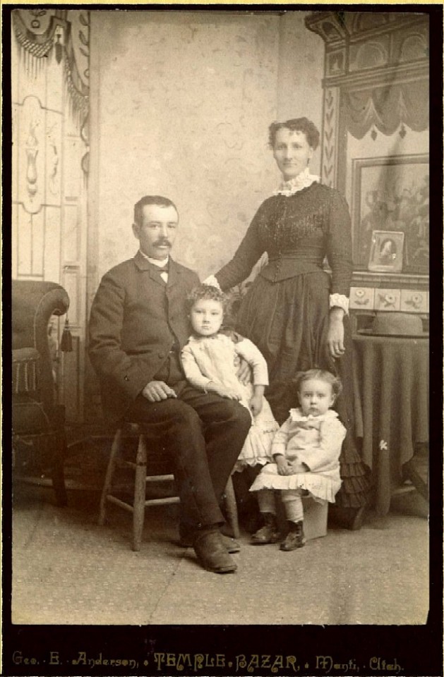 Don Mangum Bigler (1854 - 1905), his wife, Mary Henrietta Henroid (1859 - 1919) and daughters Leah (standing) and Mary Henrietta Bigler